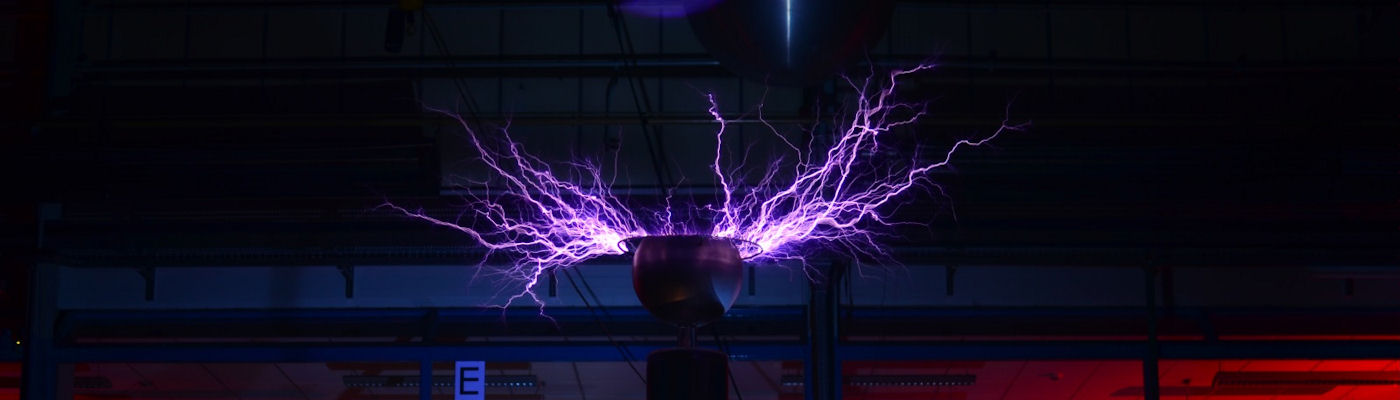 A bright purple electrical charge, in the dark